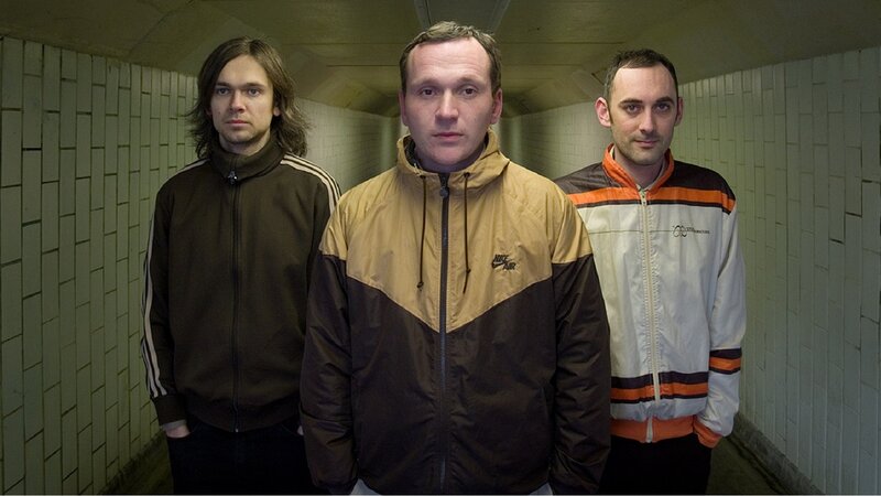 three men in a tunnel