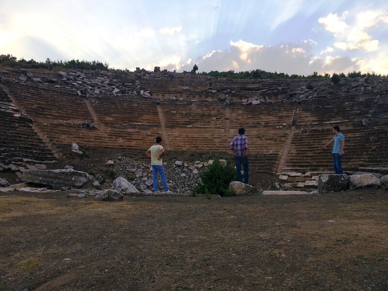 Three Men in Amphitheater