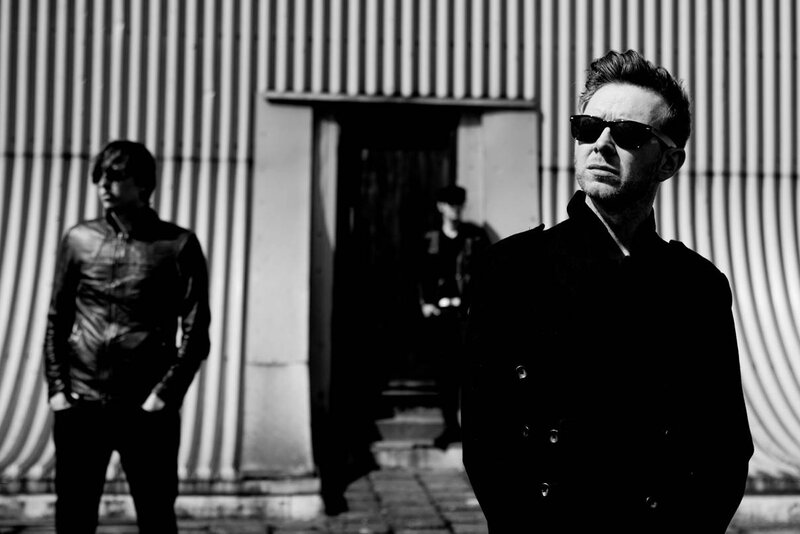 three men in black and white