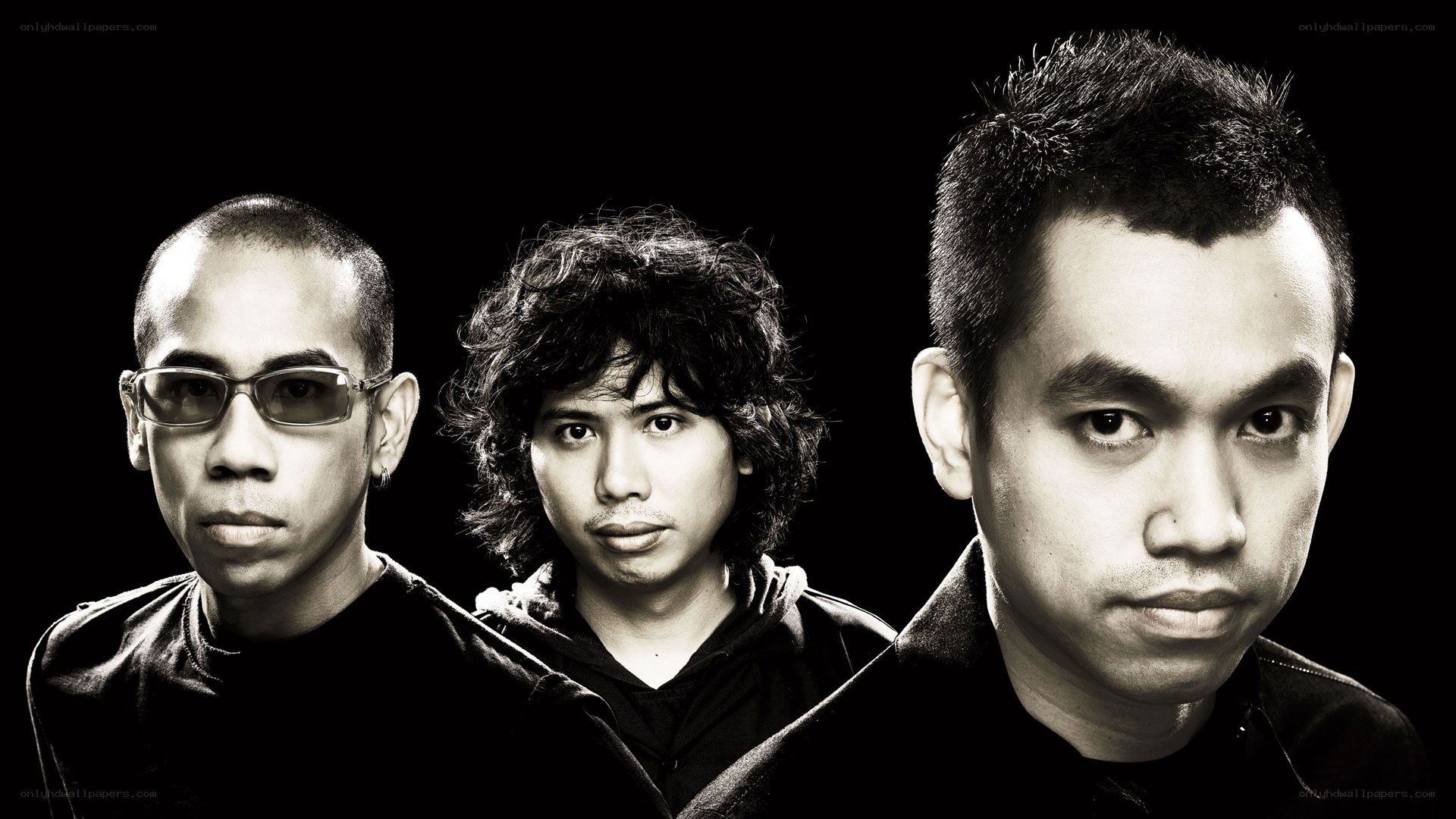 three men in black and white portrait