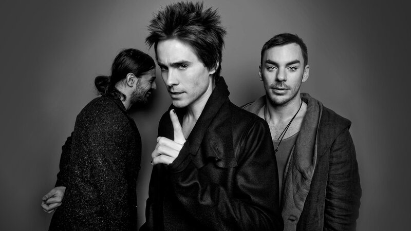three men in black and white portrait