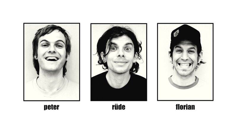 three men in black and white portraits