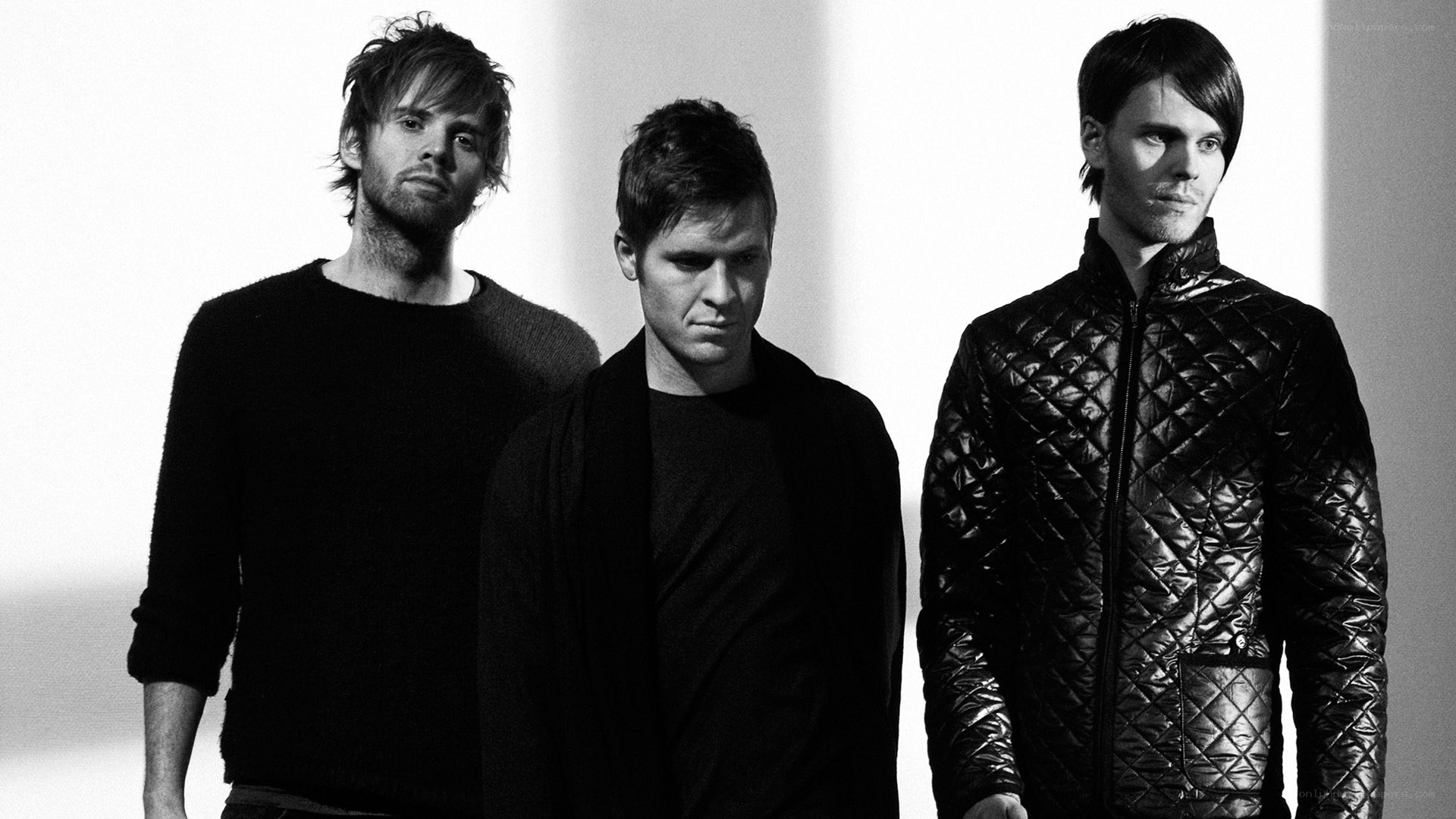 three men in black and white
