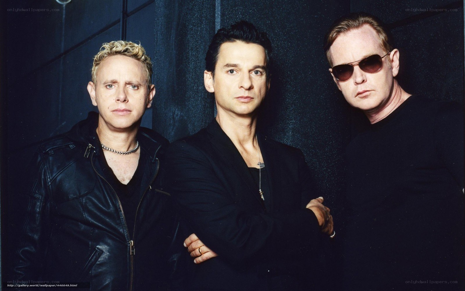Three men in black clothing