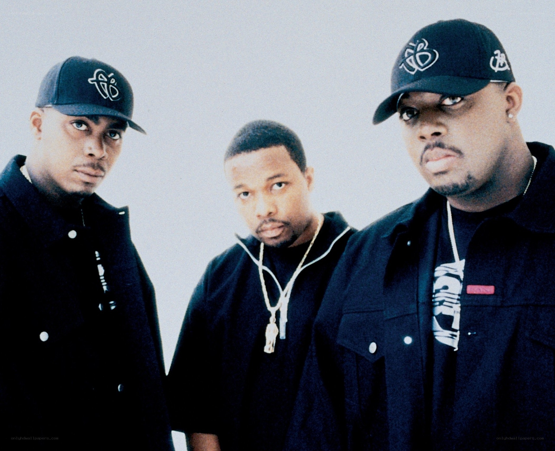 three men in black clothing