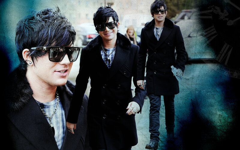 three men in black coats