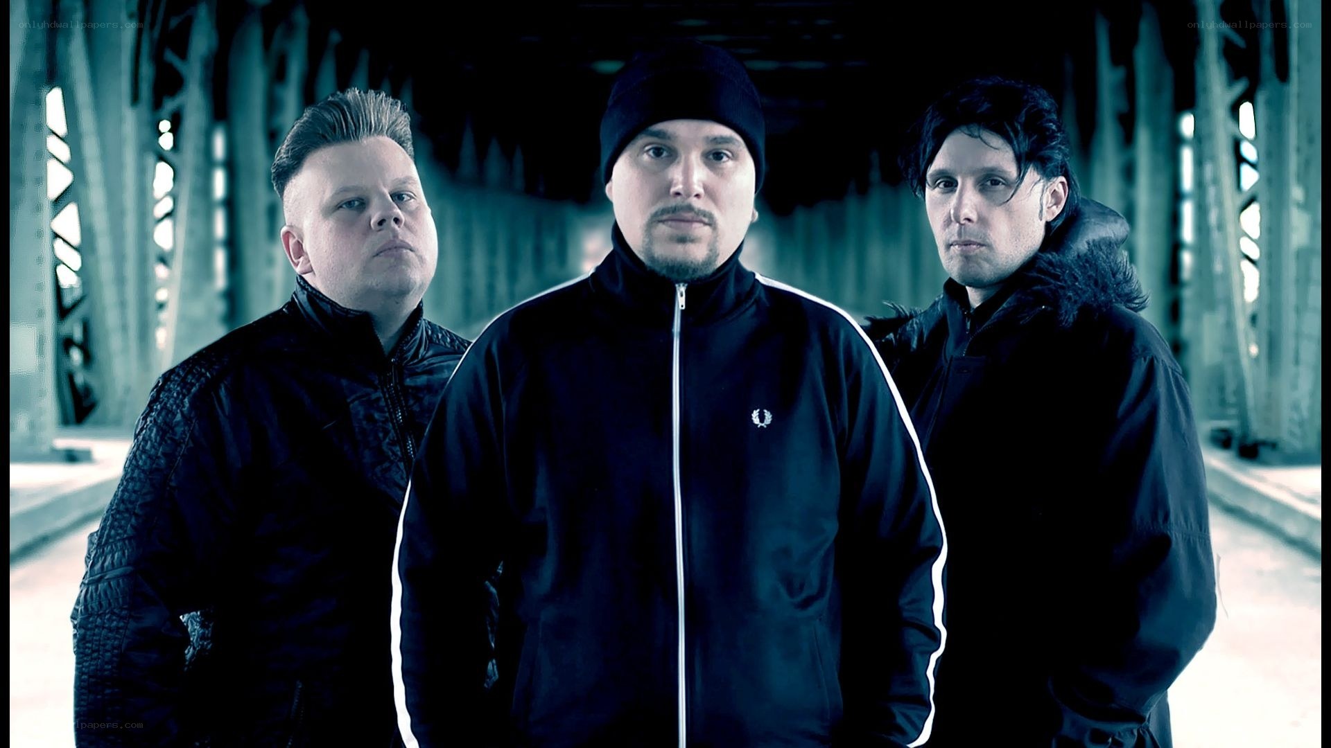 three men in black jackets
