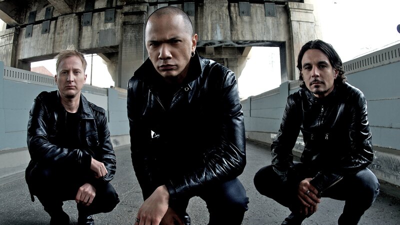 three men in black leather jackets