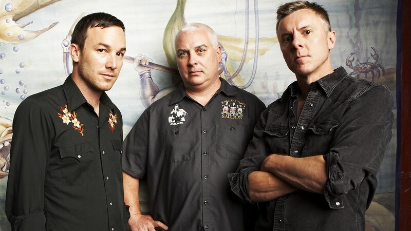 Three Men in Black Shirts — Serious, Photograph, Crab