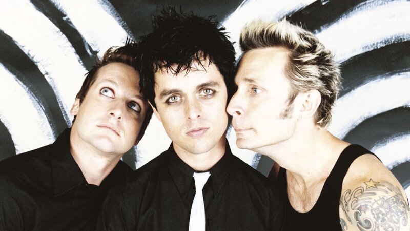 Three Men in Black Shirts — Serious, Photograph