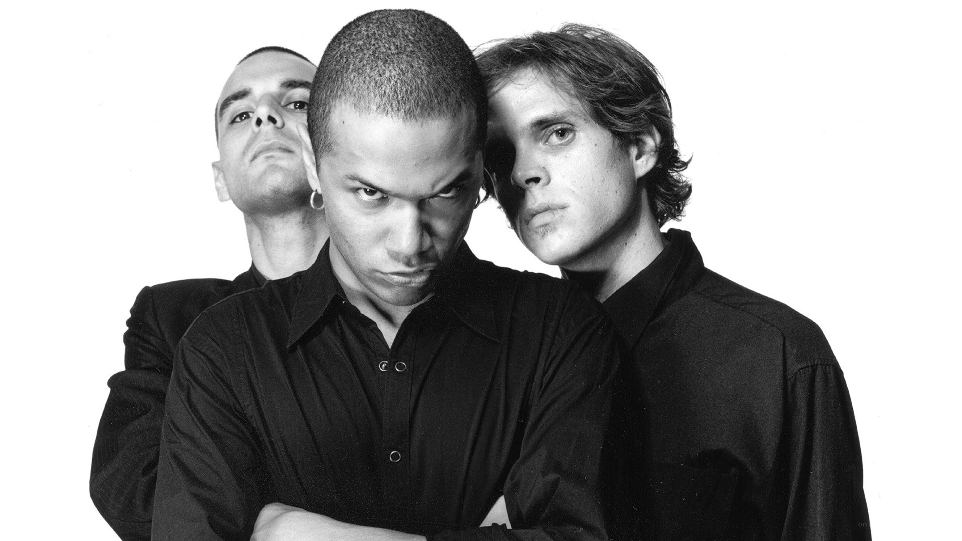 three men in black shirts