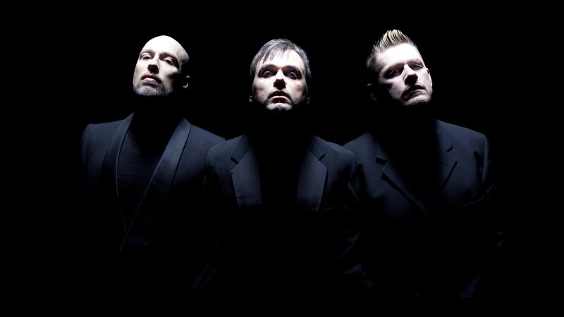 Three Men in Black Suits — Dramatic