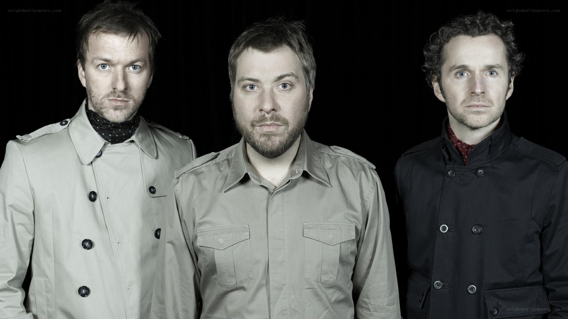 three men in coats