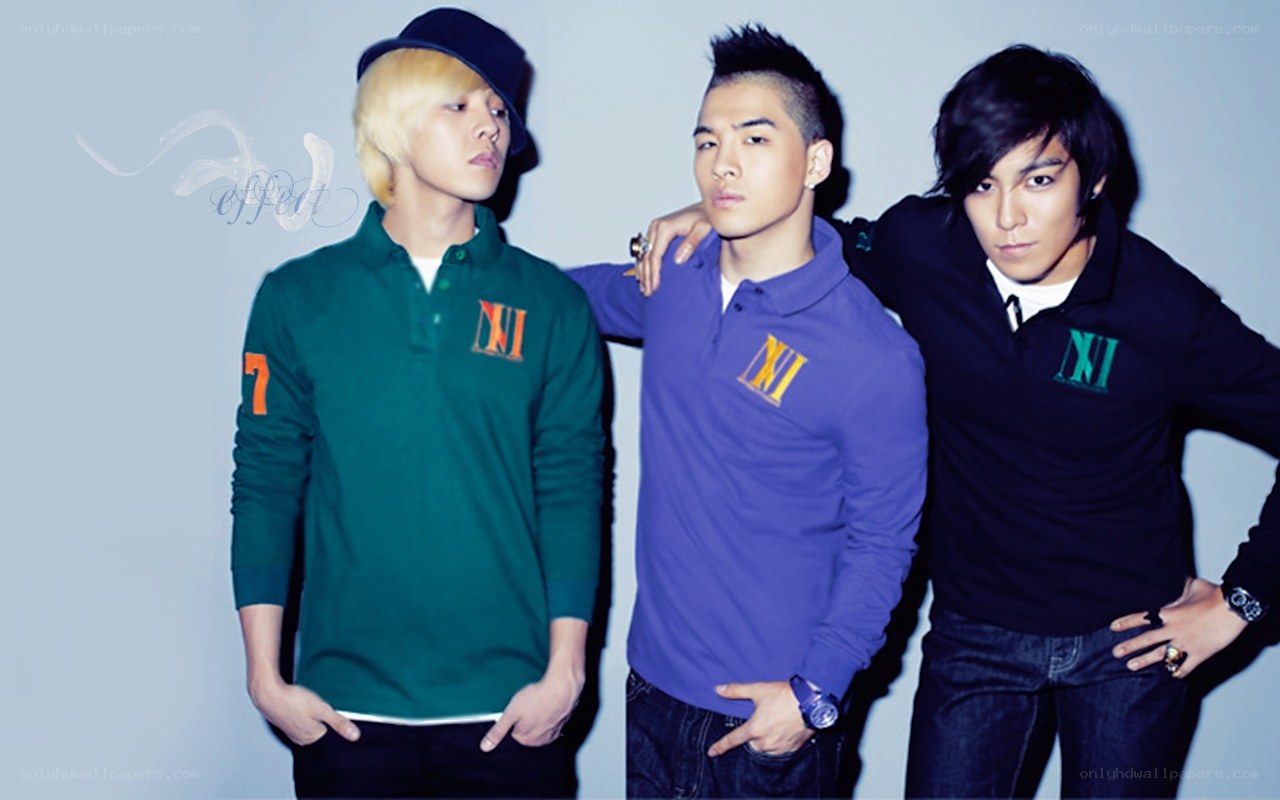 three men in colored polo shirts