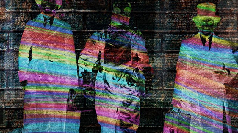 Three men in colorful stripes