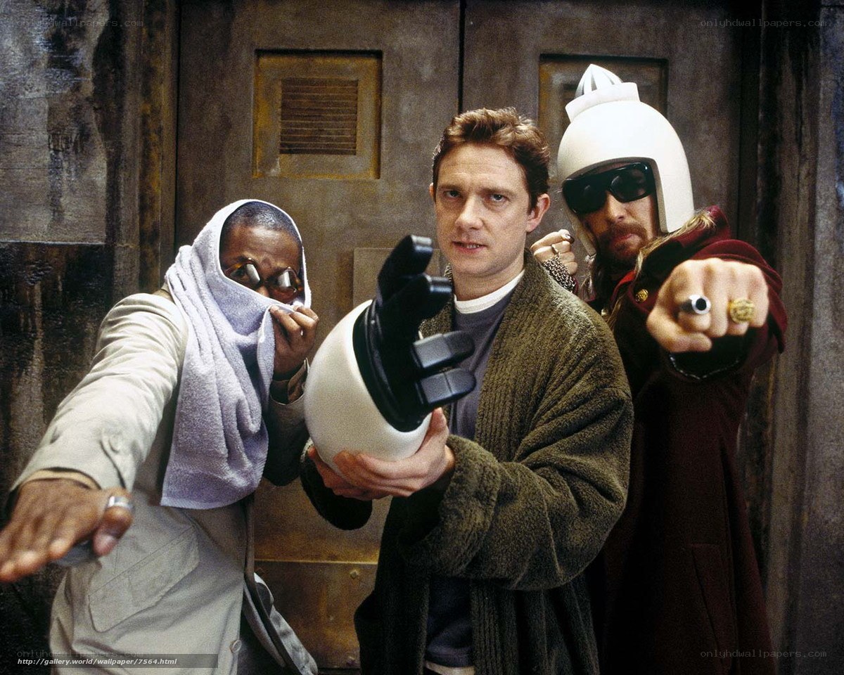 Three men in costumes pose