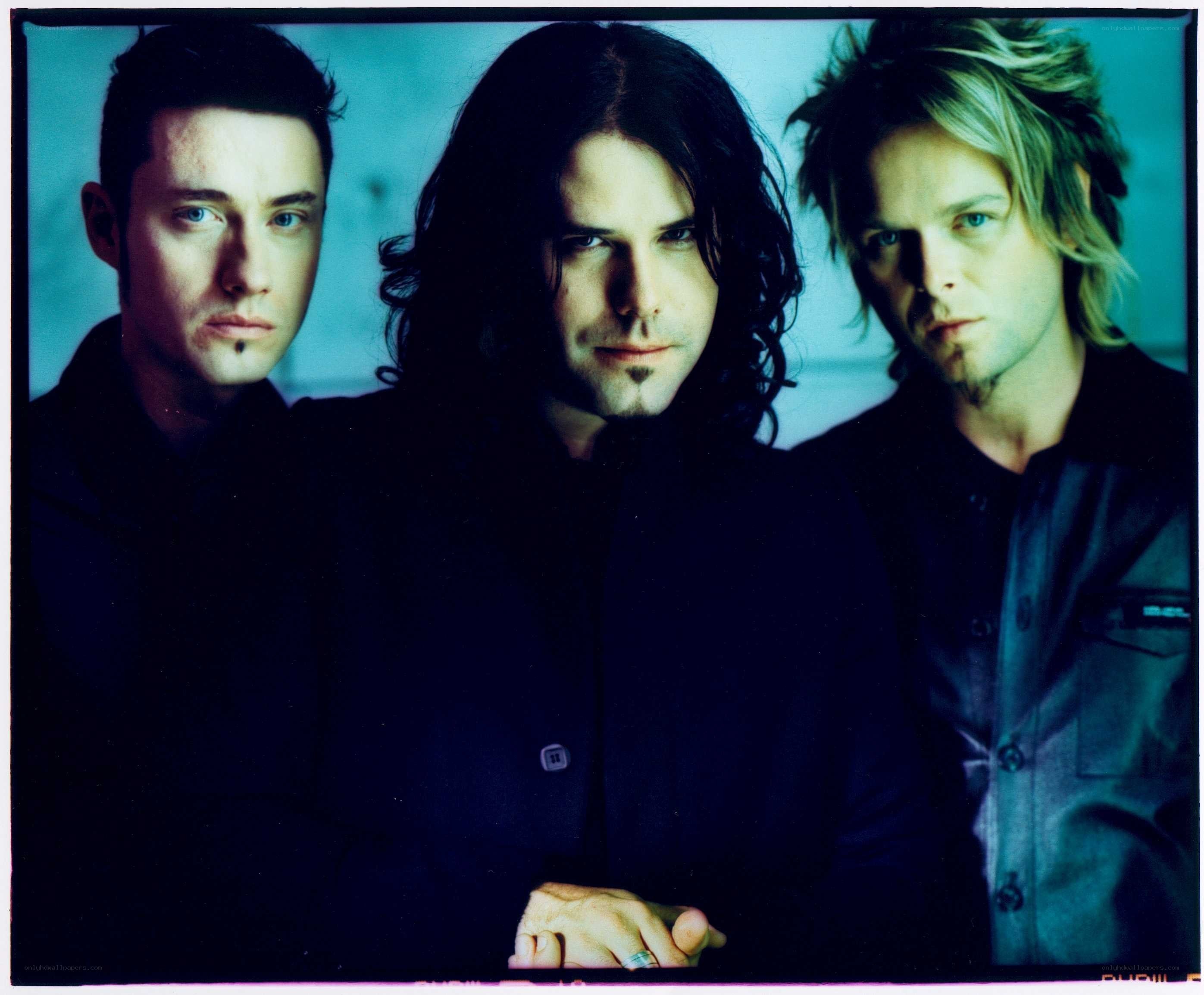 three men in dark clothing
