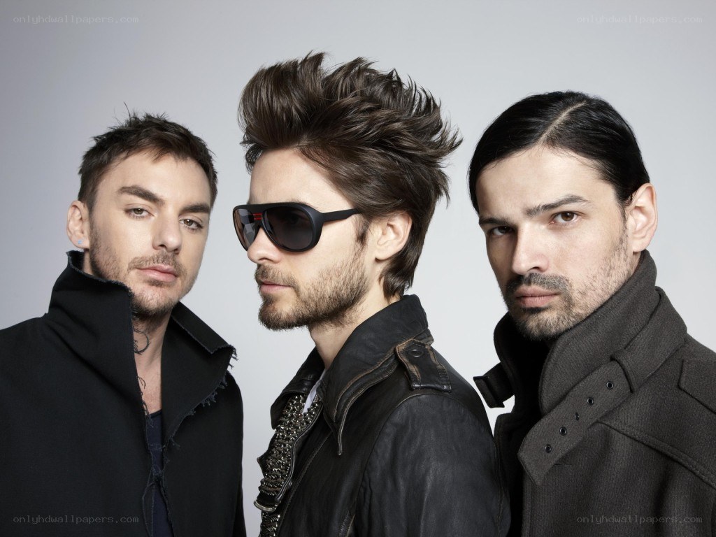 three men in dark clothing
