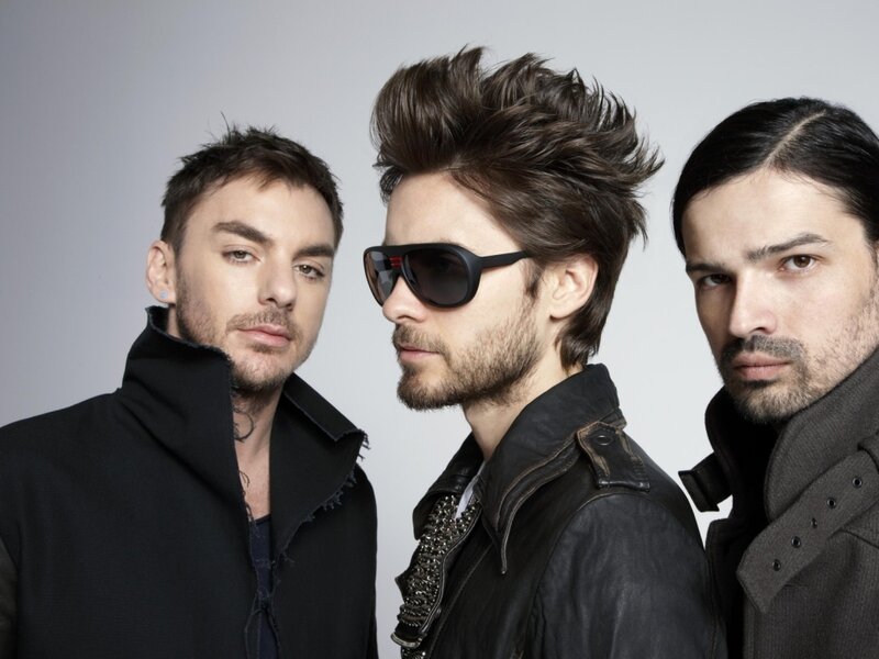 Three Men in Dark Clothing — Black, Serious