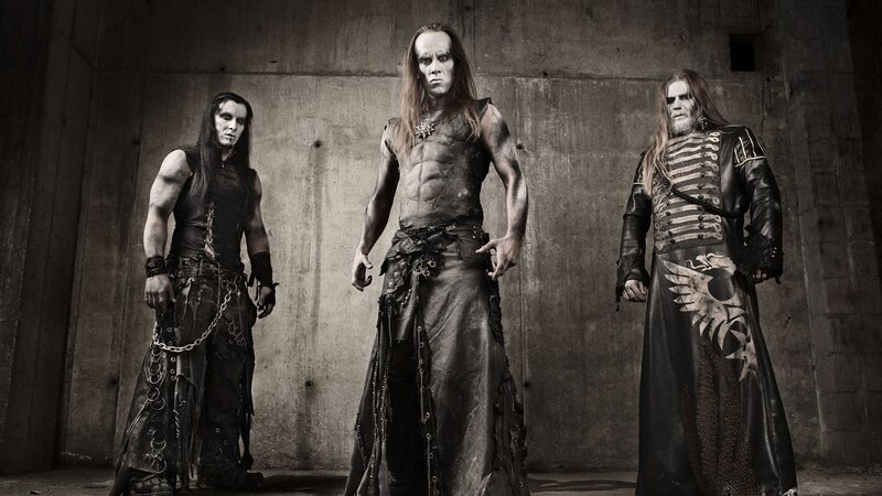 Three Men in Dark Costumes — Black, Dramatic