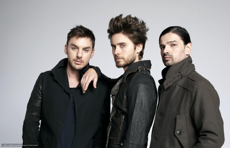 three men in dark jackets