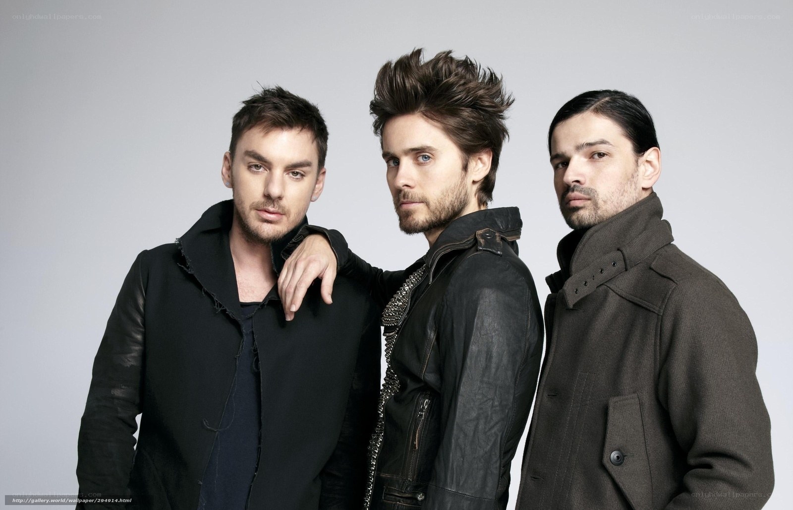 three men in dark jackets