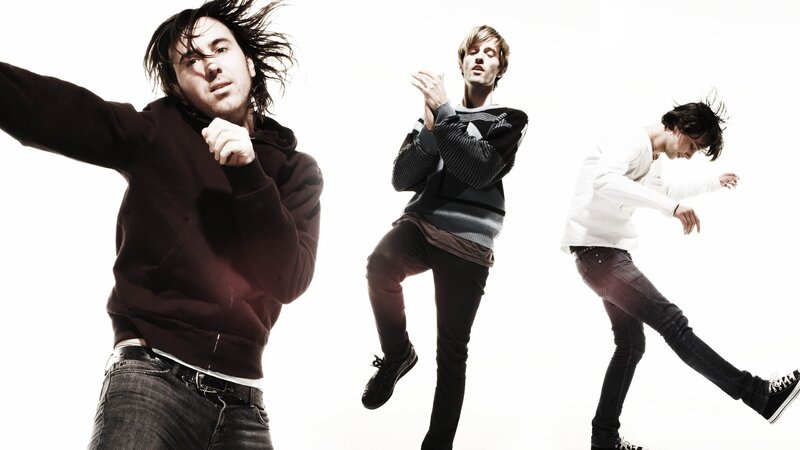three men in dynamic poses