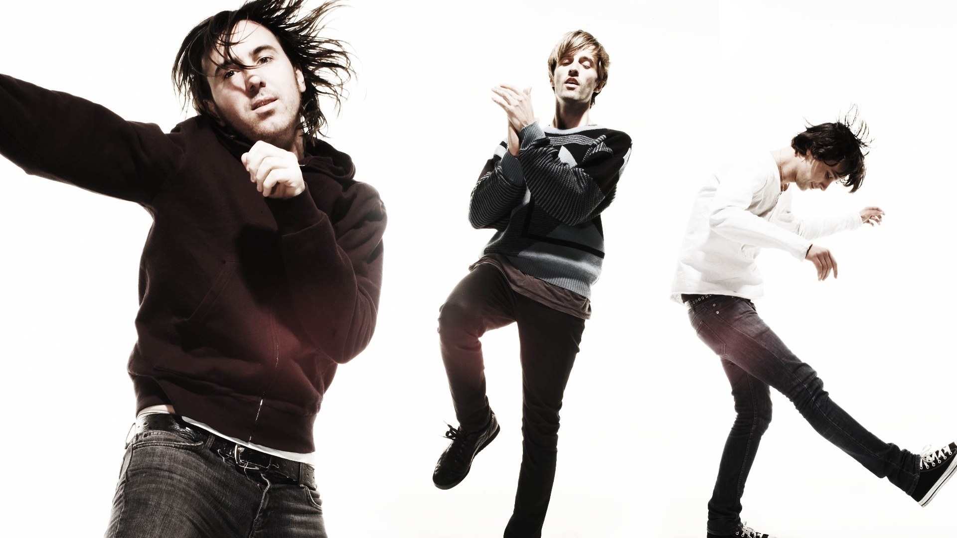 three men in dynamic poses