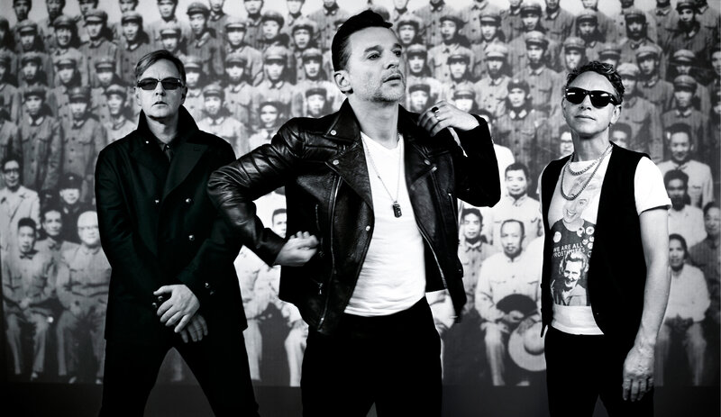 three men in front of a crowd photo