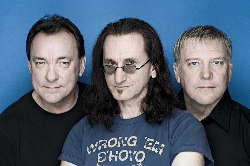 three men in front of blue background