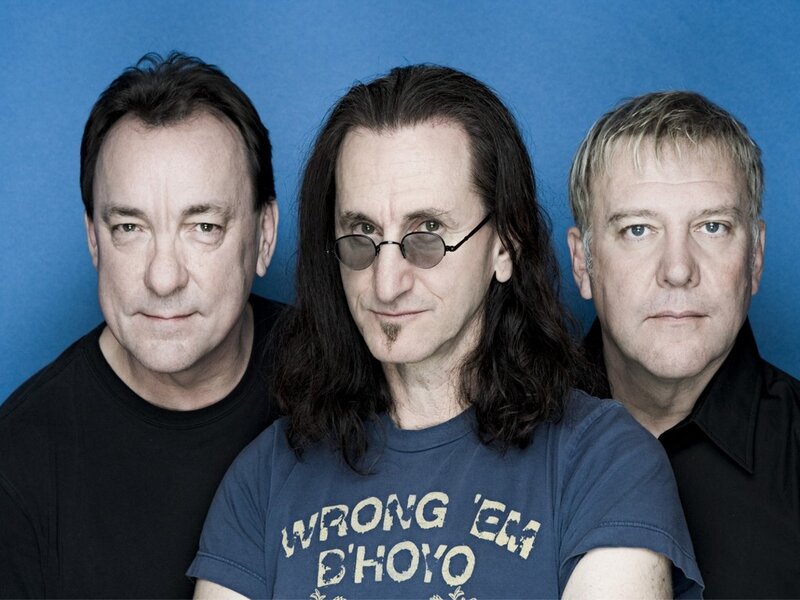 Three Men in Front of Blue Wall