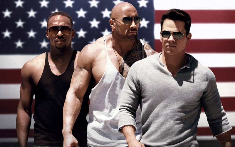 Three Men in Front of Flag