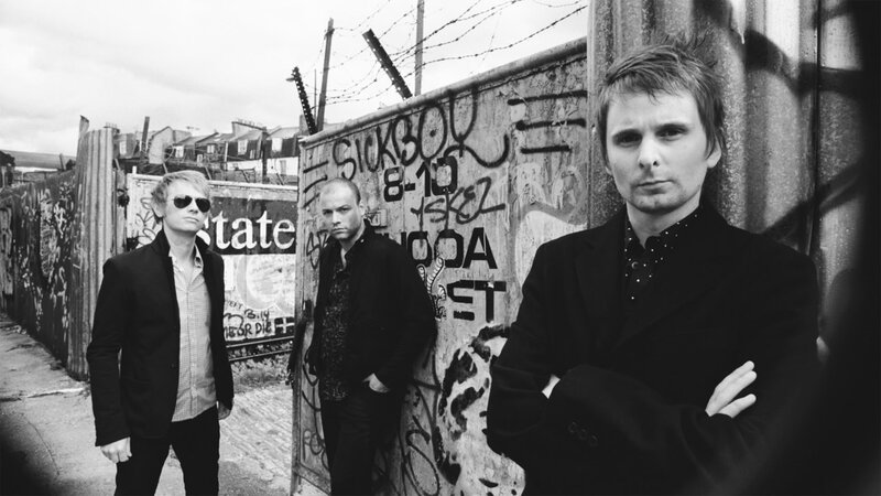 Three Men in Front of Graffiti Wall