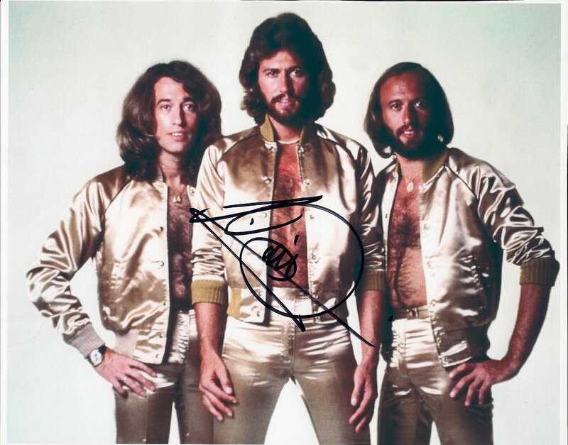 Three men in gold jackets