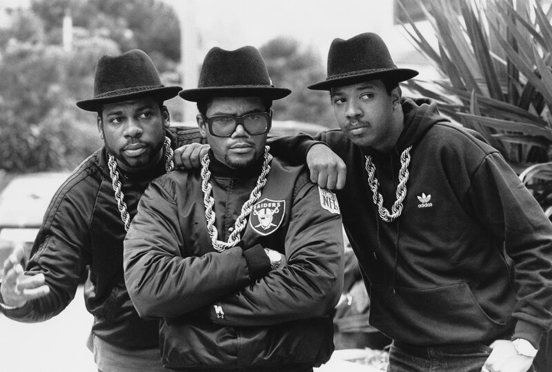 Three men in hats and chains