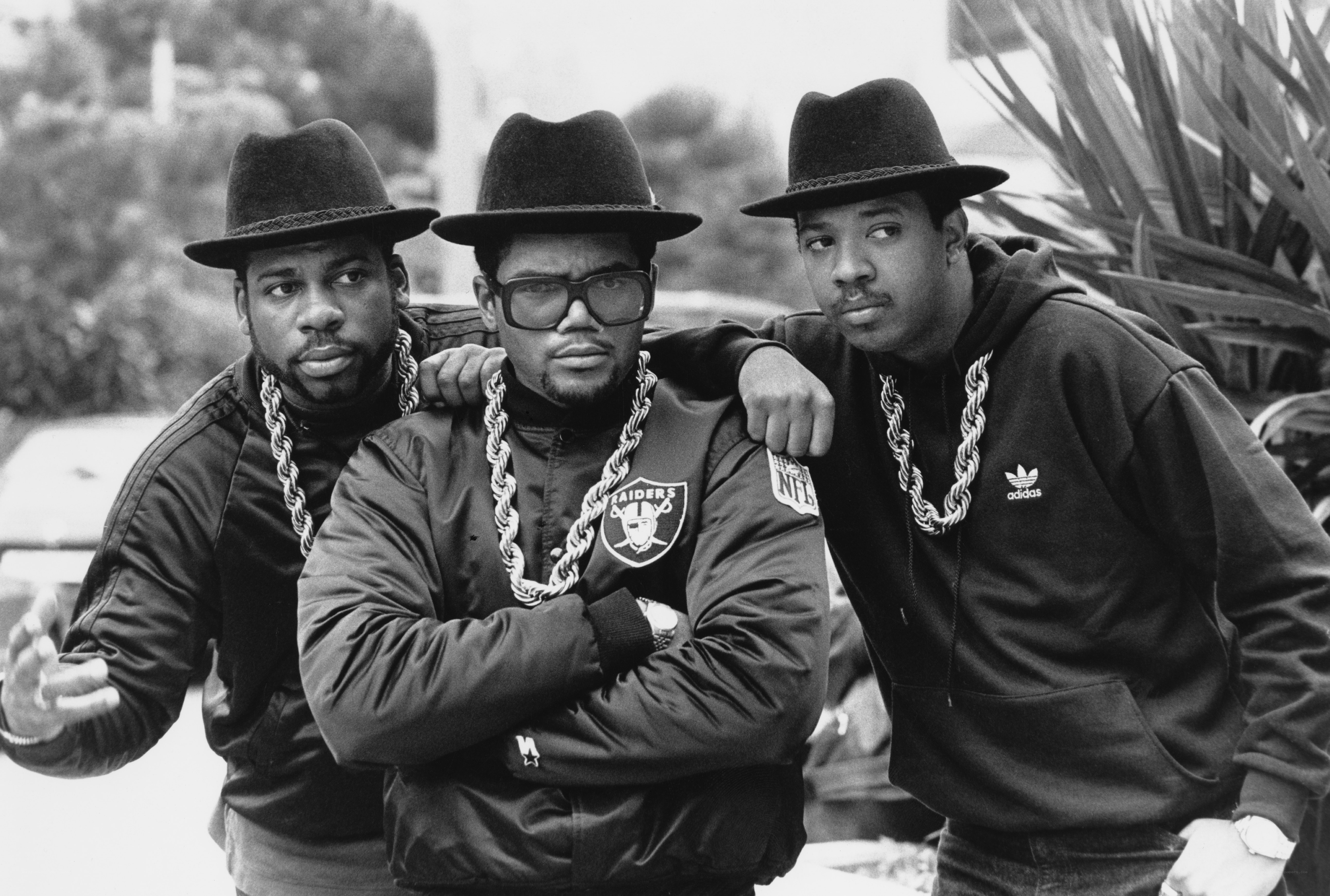 Three men in hats and chains