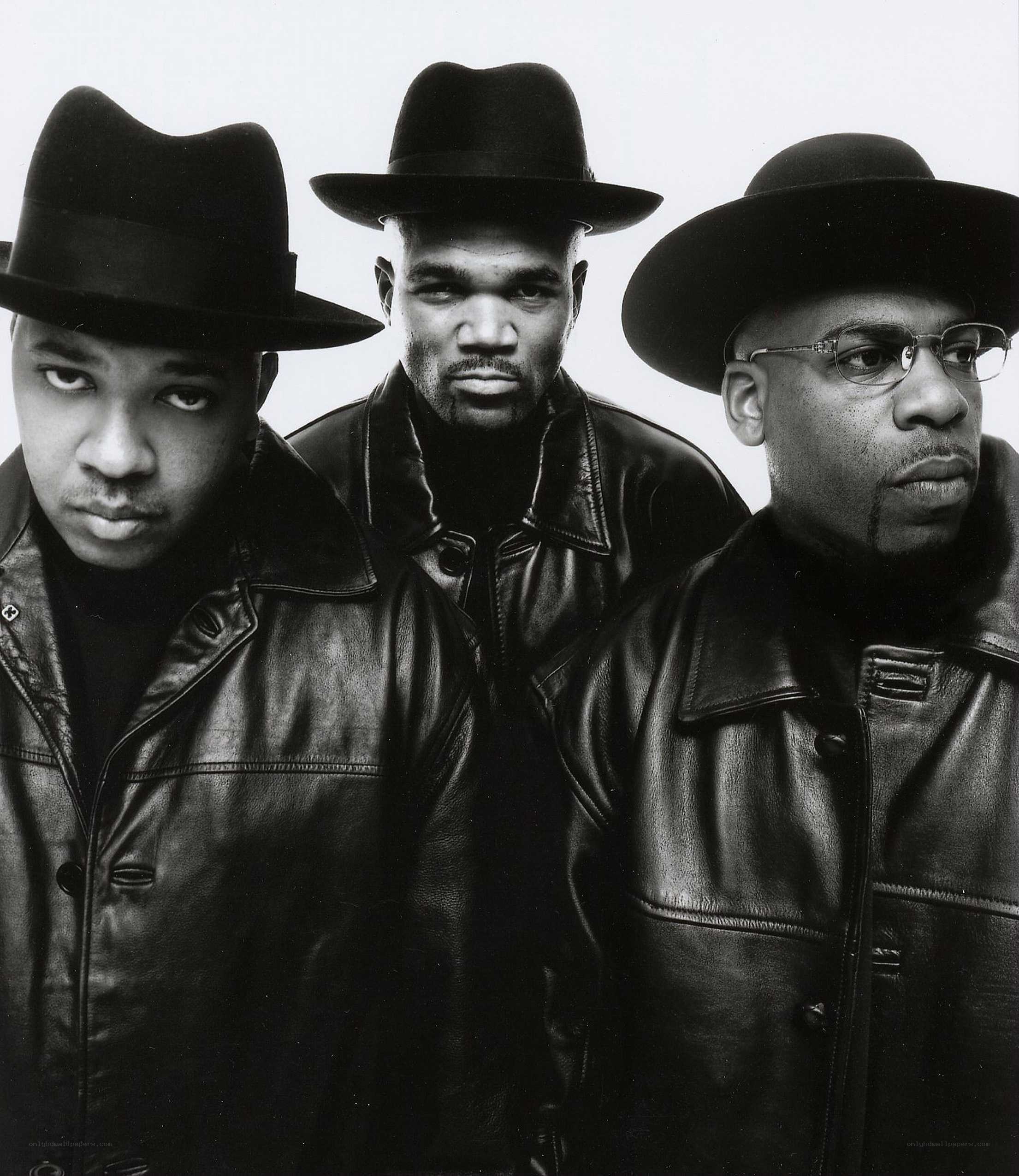 three men in hats and leather jackets