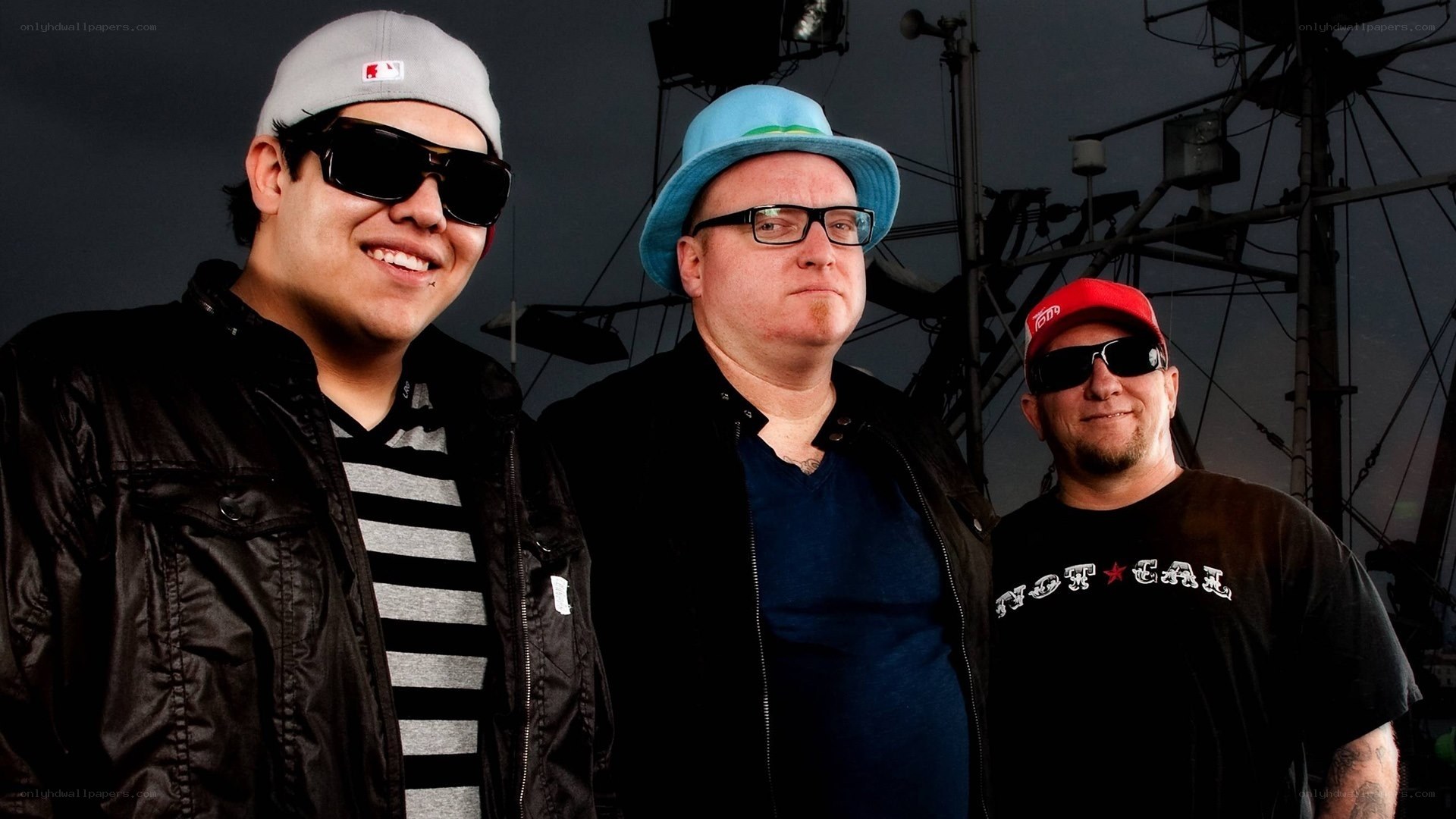 three men in hats and sunglasses