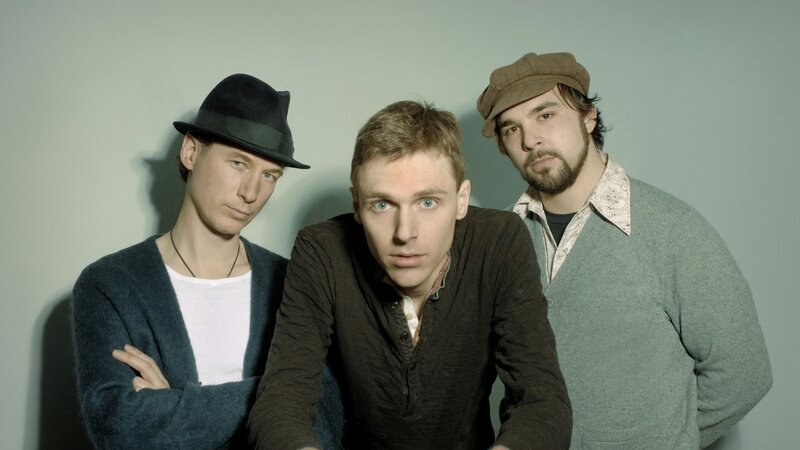 three men in hats posing