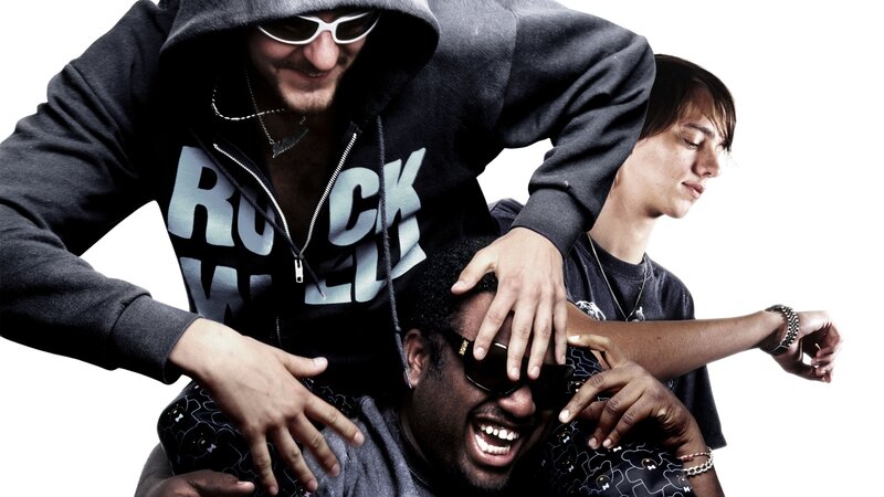three men in hoodies posing