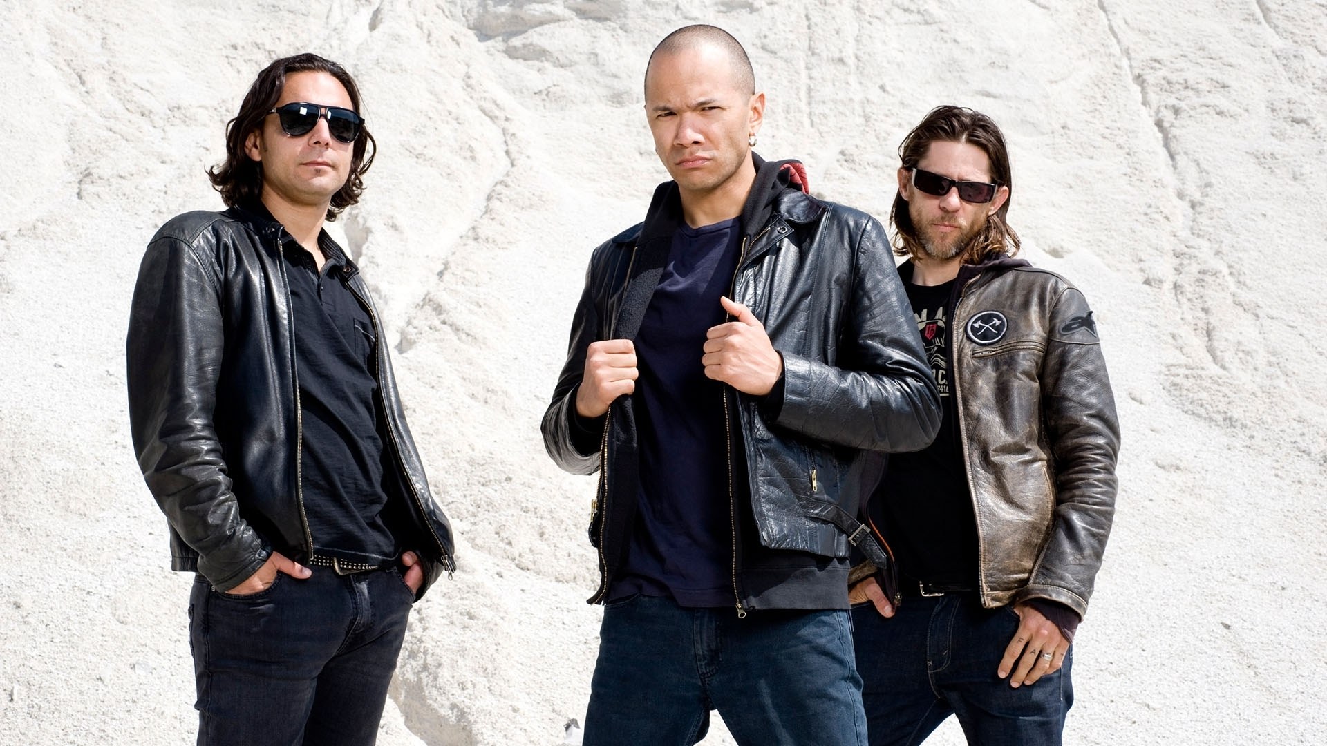 three men in leather jackets