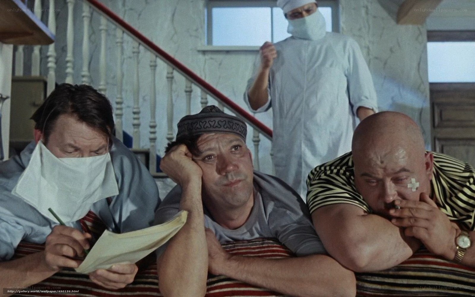Three men in medical masks