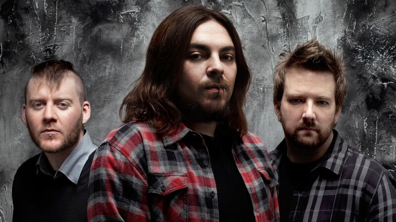 Three Men in Plaid Shirts — Gray