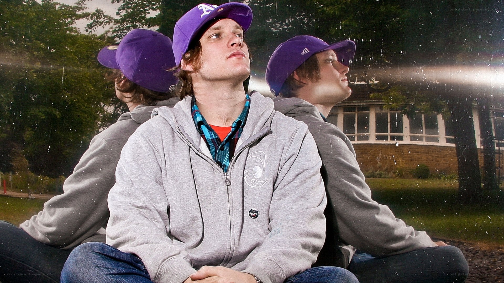Three men in purple hats