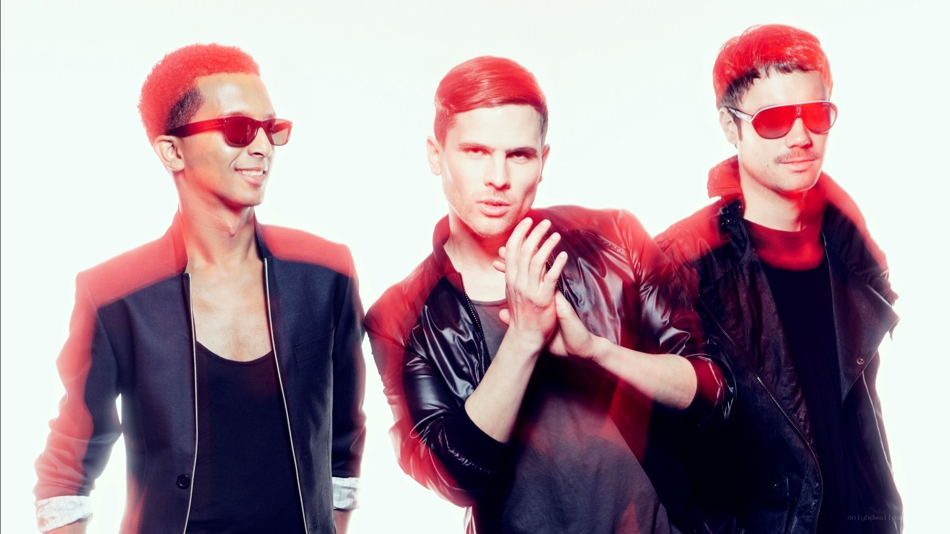 three men in red sunglasses