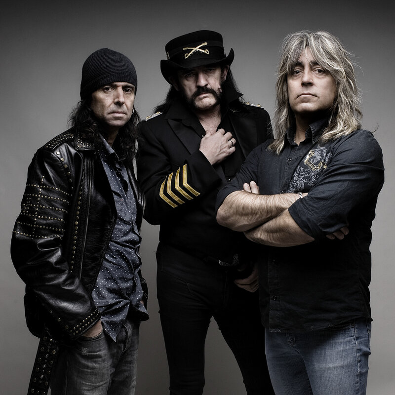 Three Men in Rock Attire — Black, Serious