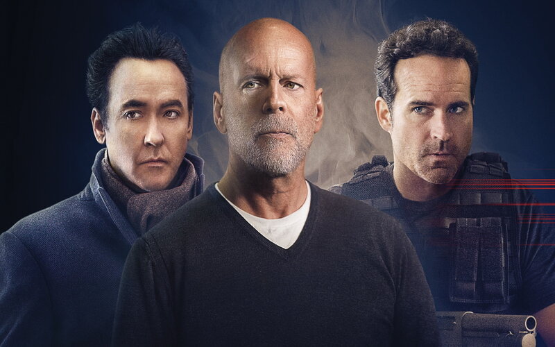 three men in serious poses