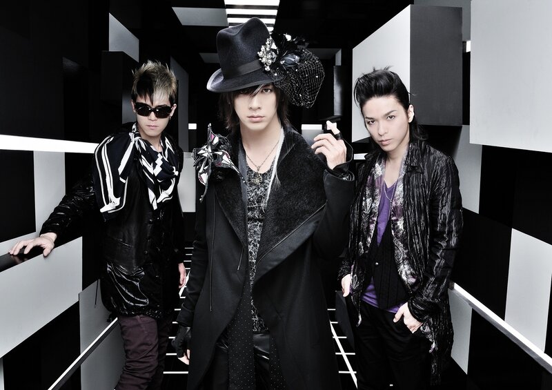 Three Men in Stylish Clothing — Black