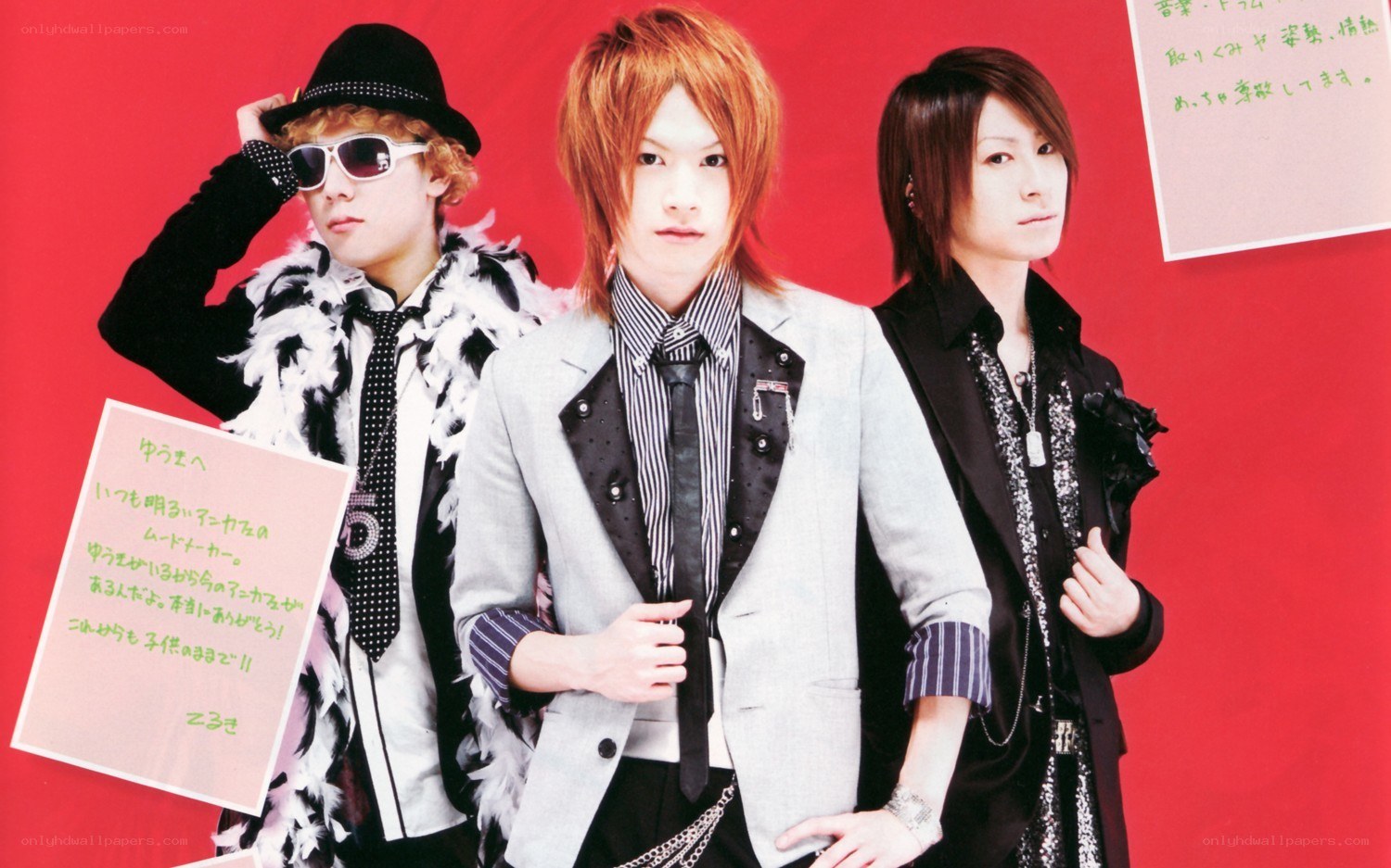 three men in stylish outfits