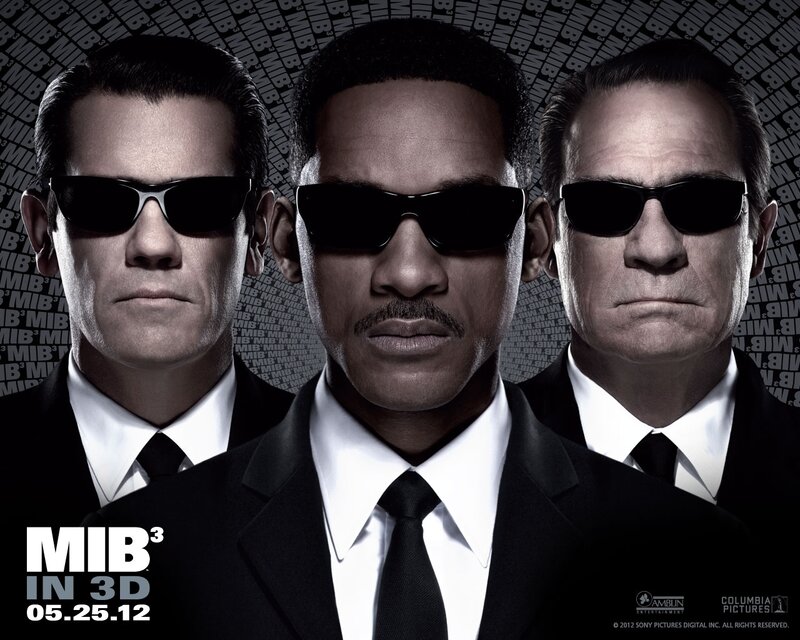 Three Men in Suits — Black, Serious
